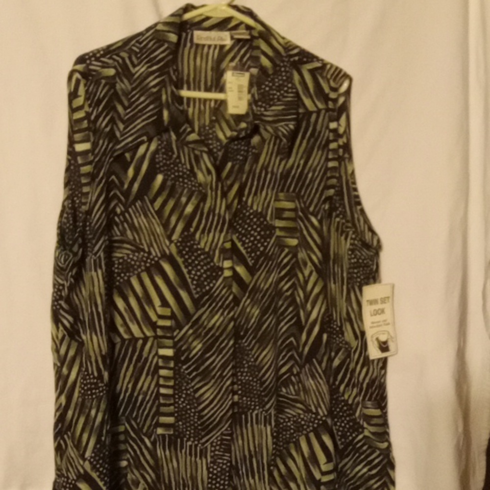 Short sleeve blouse with a tank top attached to it five buttons down the front